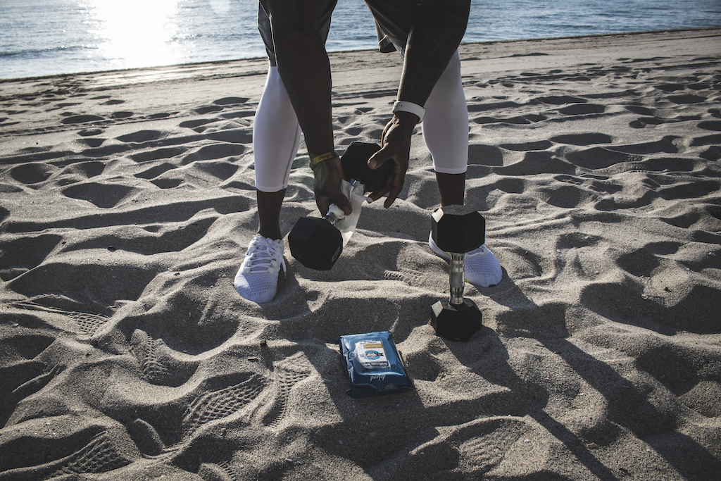 Wiping down weights with Game Face Antibacterial Wipes